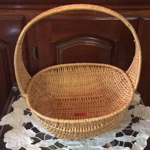 Tight hand woven basket with handle